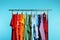 Wardrobe rack with different bright clothes