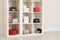 Wardrobe shelves with different stylish bags indoors.