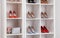 Wardrobe shelves with different stylish shoes. Idea for interior design