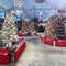 Warehouse with beautifully decorated Christmas Trees and Ornaments for sale