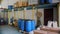 Warehouse of chemical products. Packaging. Empty cartons. Large plastic containers. Barrels. Containers. Canisters. A