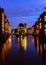 The Warehouse District - Speicherstadt in twilight. Tourism landmark of Hamburg. View of Wandrahmsfleet in light of