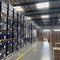 A warehouse within the factory filled with neatly stacked boxes containing solar cell parts. The image conveys the organization