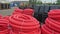 Warehouse of finished plastic pipes industrial outdoors storage site. Manufacture of plastic water pipes factory.