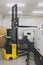 Warehouse forklift stacker loader stacking cardboxes in metal industry