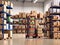 warehouse full of shelves with goods in cartons a product distribution center. generative AI