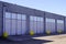 Warehouse industrial building Exterior facade with semi truck loading dock door entrance