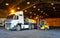 Warehouse intake, forklift lift-off sugar bags from truck to stack inside a warehouse.