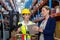 Warehouse manager with interacting female worker over digital tablet