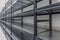 Warehouse racks storage metal pallet racking system in warehouse. Modern interior of new empty warehouse. The shelves are pallet