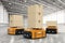 Warehouse robots carry boxes