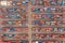 Warehouse stacking containers group in a row and cranes load unloading, distribution center for domestic product aerial top view