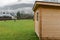 Warehouse wooden cabin outskirts of European village landmark place in spring time cloudy rainy weather day