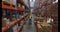 Warehouse worker carrying cardboard box on hoverboard