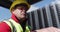 Warehouse worker driving forklift outside factory