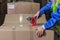 Warehouse worker packing boxes in storehouse