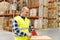 Warehouse worker packing parcel with scotch tape