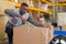 Warehouse worker preparing shipment in large warehouse