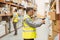 Warehouse worker scanning barcode on box