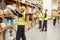 Warehouse worker taking package in the shelf