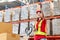 Warehouse worker working in factory warehouse industry and using radio talking communication, Foreman in hardhat safety vest with