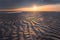 Warm afternoon sun rays on a beach at low tide in Taiwan with warm colour on sand patterns