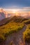 Warm afternoon sun setting down over the clouds in warm colors on a hiking path from the top of HeHuanShan in Taiwan