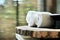 Warm atmosphere in spa resort, Close up of spa essentials and towels on wooden tray in bathroom, essential oil.