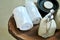Warm atmosphere in spa resort, Close up of spa essentials and towels on wooden tray in bathroom, essential oil.