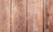 Warm brown wooden texture. Timber board top view photo background. Rustic wood backdrop.