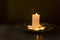 Warm and calm atmosphere.Candles on the golden tray against glass background.Empty space