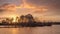 Warm colored sunrise with dramatic clouds in a wetland, The Netherlands