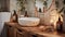 a warm, cozy bathroom featuring a close-up shot of a white terrazzo undermount sink illuminated by candlelight