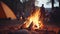 Warm cozy campfire flames dance in dusk with tent camping background inviting atmosphere for camping
