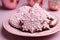 Warm and cozy with ginger cookies with pink icing for Christmas,a traditional treat