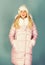 Warm and cozy. Girl wear winter jacket blue background. Fashion trend. Winter season of contrasts. Style code with