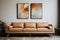 A warm and cozy interior with brown leather couch and canvas frames on the wall. Generative AI