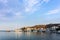 Warm dawn colors over the harbor of Patmos island, Dodecanese, Greece