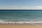 Warm day on a Cannes beach with azure waves of mediterranean sea