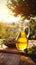 Warm evening light on a glass jug of olive oil with a bowl of assorted olives, rustic charm