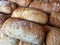 Warm fresh breads in a bakery shelf display