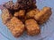 Warm fried tempe just finished frying, attractive brown color and served on a beautiful plate