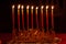 Warm glow of Hanukkah candles burning brightly on the eighth night of the Festival of Lights.