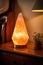 warm, glowing salt lamp on a bedside table