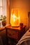 warm, glowing salt lamp on a bedside table