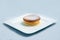 Warm Hero Shot of a pan cake on a plate, on a minimal white background with a diagonal 60 degree angle