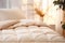 Warm ivory duvet quilt lying on bed in cozy bedroom. Preparing for winter season, household, domestic activities, hotel