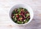 Warm kale salad with brown rice, dried cranberries and nuts