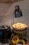 Warm light from lamp over Deep fried Chinese dough by soy milk pot for breakfast. Detail of buffet served in line