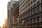 Warm light of sunset shines on the buildings along 23rd Street in New York City